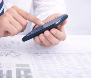 Accountant viewing smartphone.